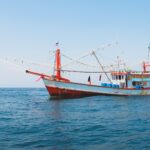 Image of a commercial fishing boat in the open ocean